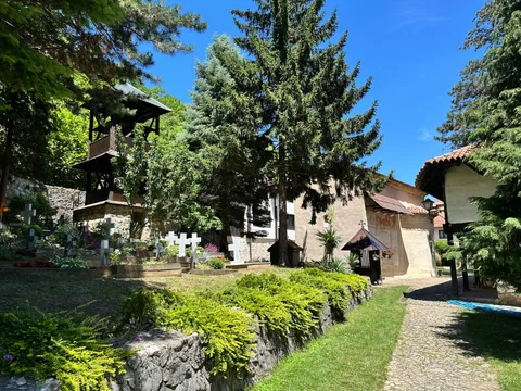Nikolje Monastery courtyard with bell tower and cemetery